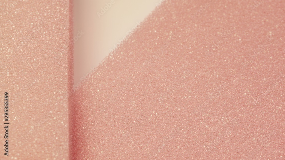 Fototapeta premium White pink artificial foam, soft texture on a light background.
