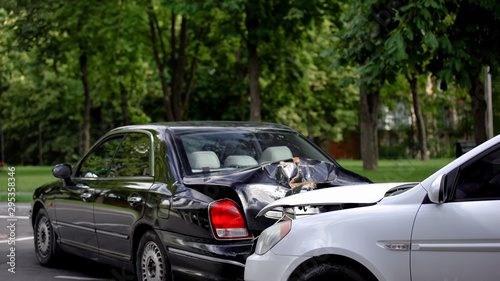Broken cars on street, transport accident, traffic collision, vehicle insurance © motortion