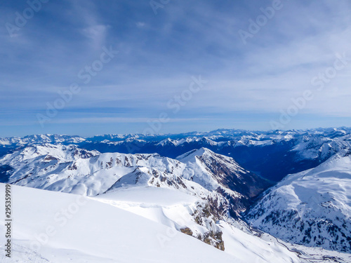 Beautiful and serene landscape of mountains covered with snow in Mölltaler Gletscher, Austria. Thick snow covers the slopes. Clear weather. Perfectly groomed slopes. Massive ski resort. Glacier skiing © Chris