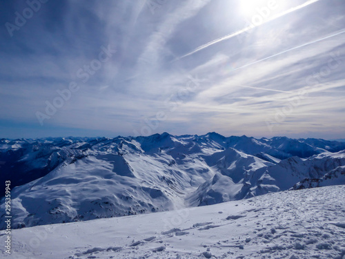 Beautiful and serene landscape of mountains covered with snow in Mölltaler Gletscher, Austria. Thick snow covers the slopes. Clear weather. Perfectly groomed slopes. Massive ski resort. Glacier skiing © Chris