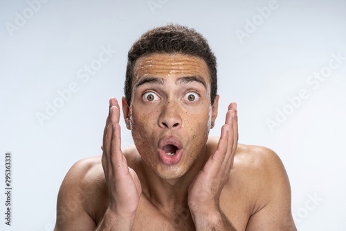 Young man being surprised with his look