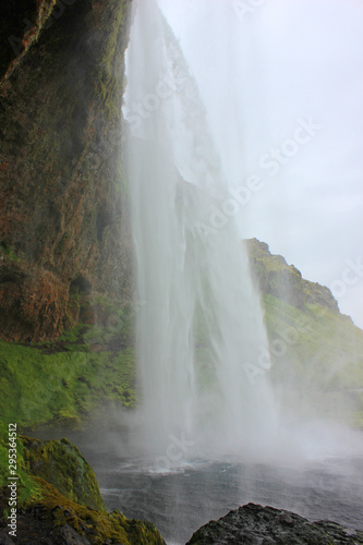 Behind the impressive seljalandsfoss waterfall