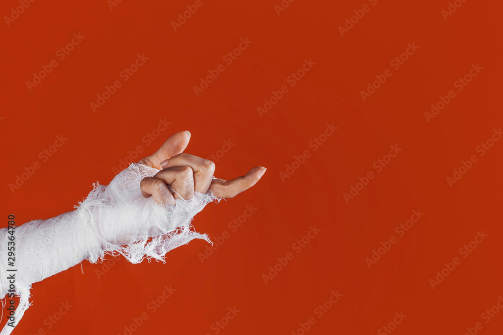 Halloween, costume image. The mummy's hand in bandages making gestures Halloween, costume image. The mummy's hand in bandages making gestures