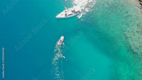Sailing yacht moored to the shore, a delightful seascape drone photo. © Ulia Koltyrina