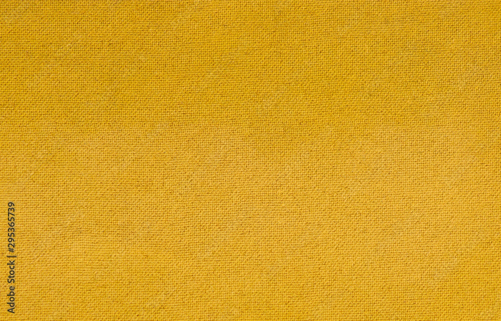 Hardboard. Bumpty surface, texture of construction material close-up. Flip side of hardboard. Yellow background. Hardboard. Bumpty surface, texture of construction material close-up. Flip side of hardboard. Yellow background.