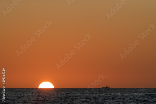 half solar disc on the horizon © Pictoramix