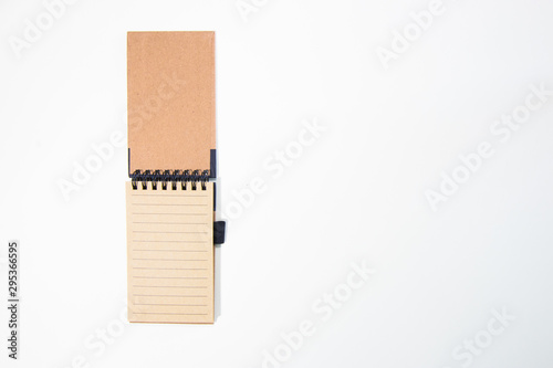 Brown notebook in white background