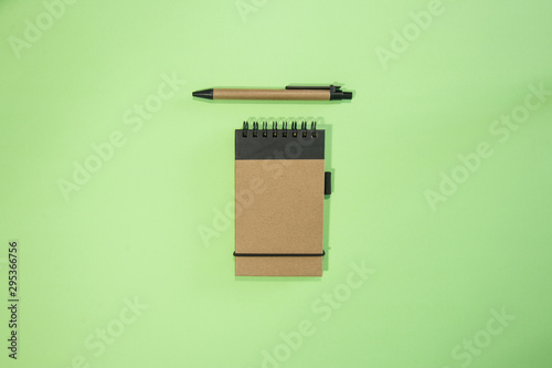 Brown notebook in green background