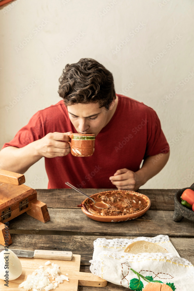 detail of typical mexican breakfast. delicious plate of birria detail of typical mexican breakfast. delicious plate of birria