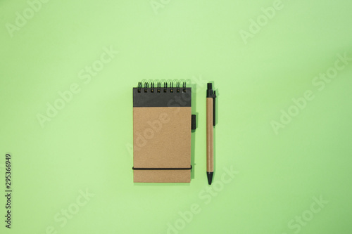 Brown notebook in green background