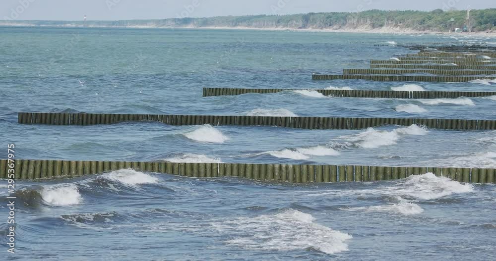 Breakwater of larch logs. Strengthening the seashore to keep the sand ...