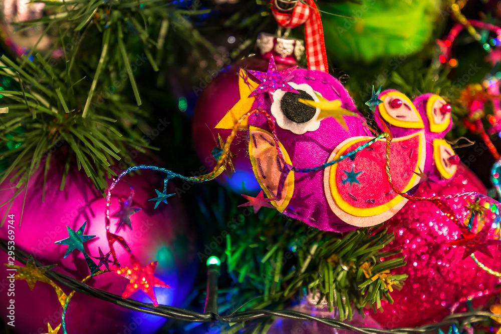 colorful bird decoration in the christmas tree