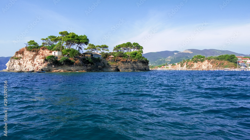 Zakynthos Island, Greece - September 11, 2019: Cameo Island is available through a picturesque wood bridge in the port of Agios Sostis, next to Laganas Resort. Beauty of nature concept background 