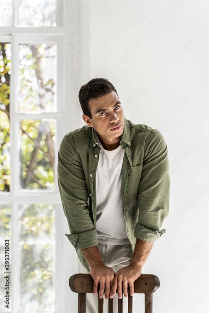 Handsome man getting ready before going outside Handsome man getting ready before going outside