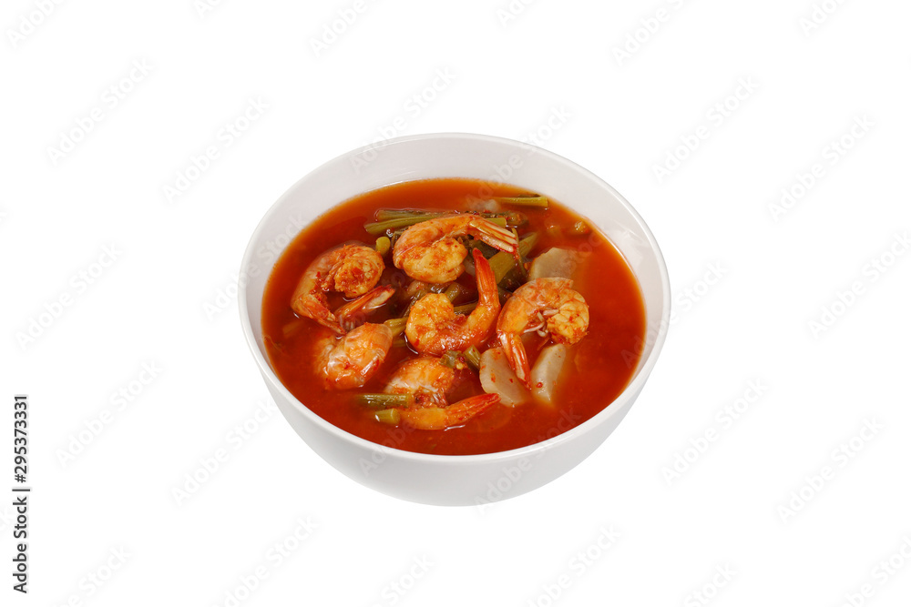 Sour curry soup with shrimp, White Radish and bok choy (kaeng som kung) isolated on white background Sour curry soup with shrimp, White Radish and bok choy (kaeng som kung) isolated on white background