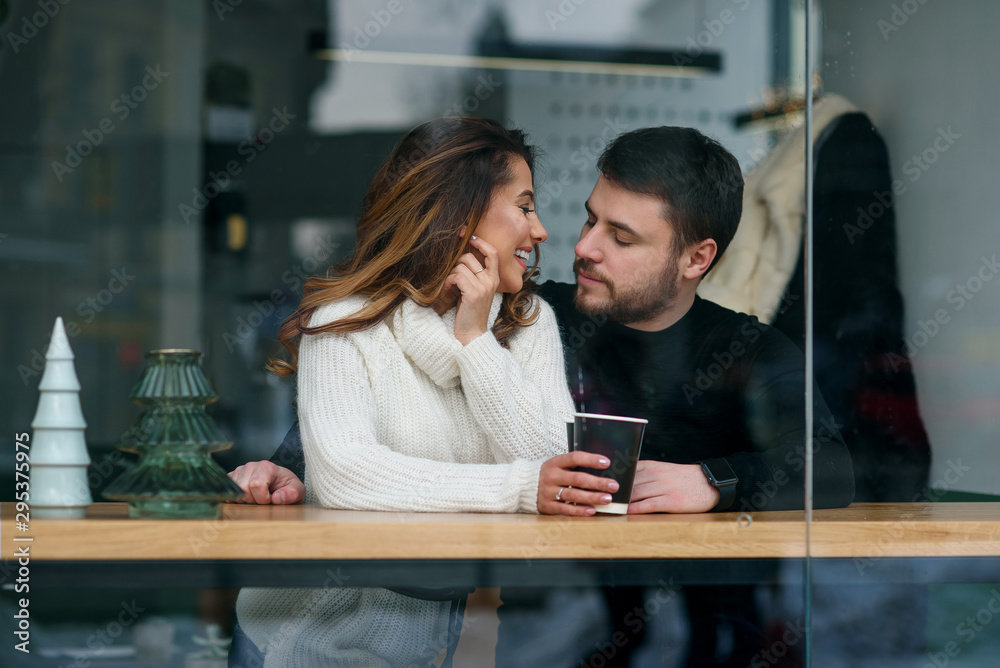 Beautiful caucasian couple in love drink coffee at cafe. Love and romantic concept. Beautiful caucasian couple in love drink coffee at cafe. Love and romantic concept.