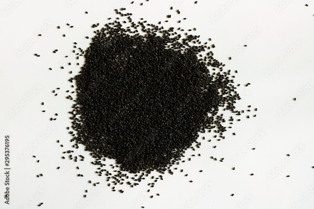 Dry sweet basil seed. Handful on white empty background. Healthy and super food. Horizontal. Isolate. Dry sweet basil seed. Handful on white empty background. Healthy and super food. Horizontal. Isolate.