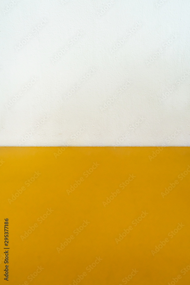Half of yellow background with white wall Half of yellow background with white wall