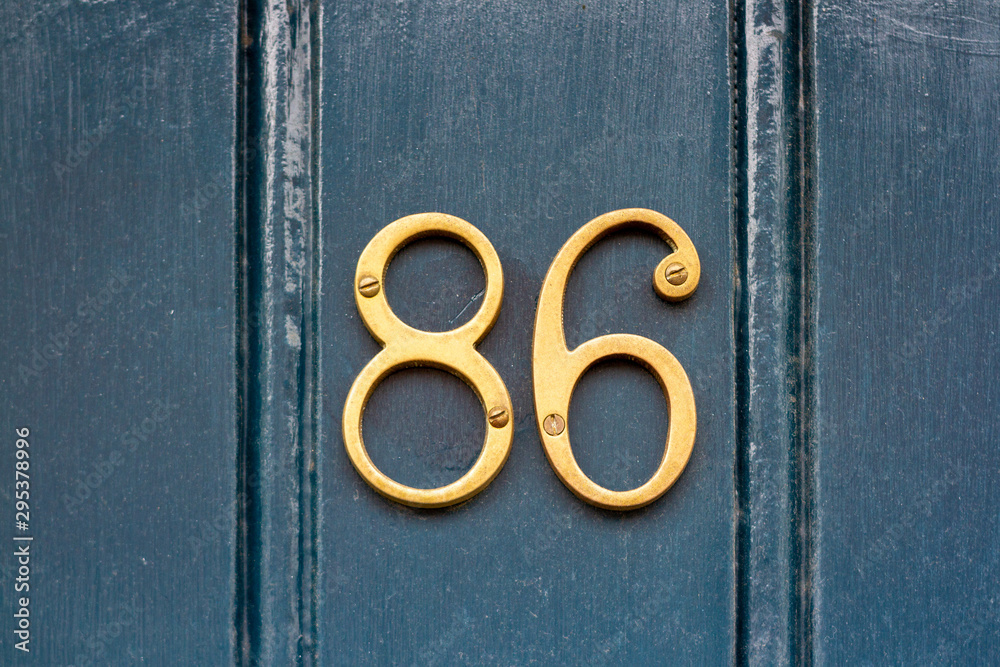 House number 86 in golden metal digits House number 86 in golden metal digits