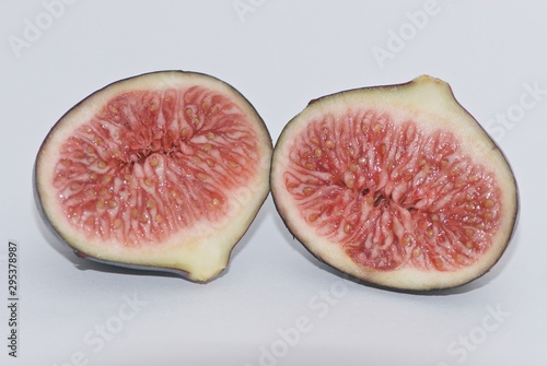 Two tasty shiny figs in cross section from France