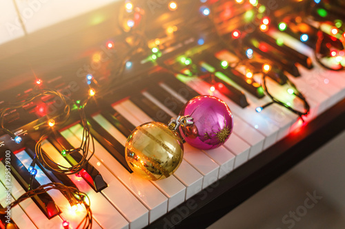 Photography Piano keyboard with Christmas decoration, closeup
