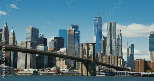 Brooklyn bridge during sunset over Manhattan with Cityscape of New York, USA. 4K time lapse