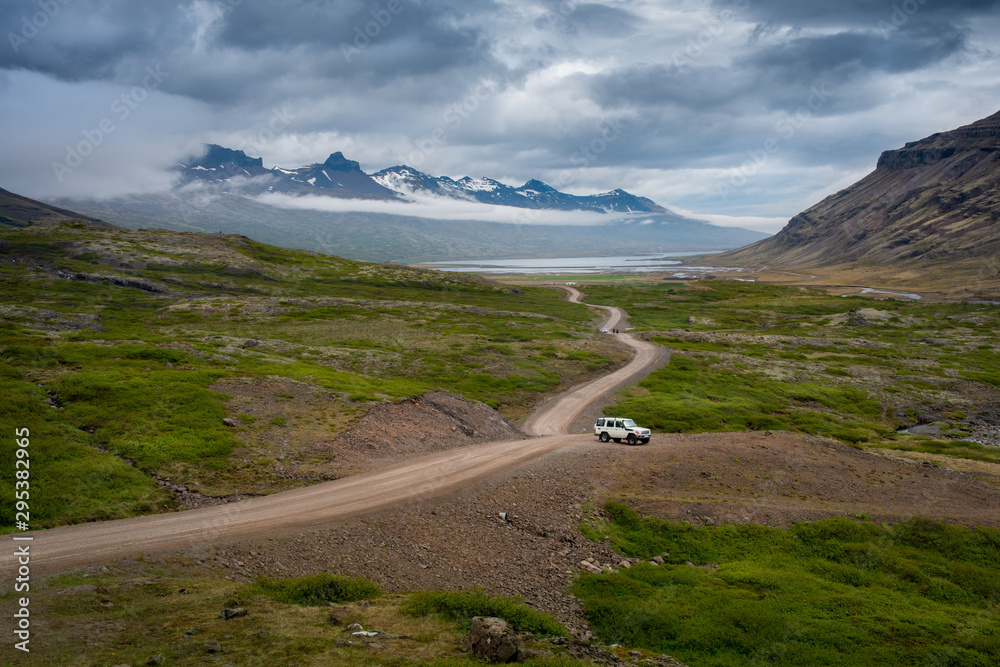 White Off-road car on the icelandic road.