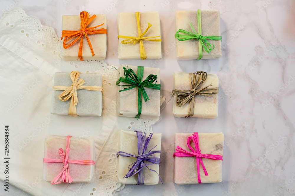 Handmade Organic Craft Soap In Gift Wax Wrapping Paper With Multi Colored  Eco Raffia Ribbons On Marble Surface With Space For Text Present Gift Soap  Flat Lay Top View Stock Photo 