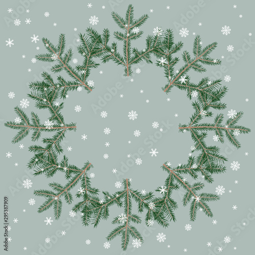 Winter Christmas decor. Round floral frame. Wreath of pine or fir branches and snowflakes.
