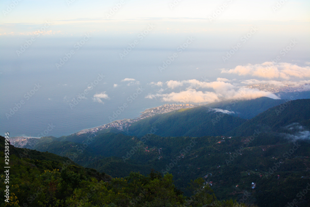 View of the Mountain Chain of El Avila in Venezuela, blue sky and caribbean sea in the background