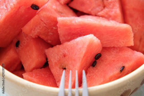 slices of watermelon in a bowl, closeup