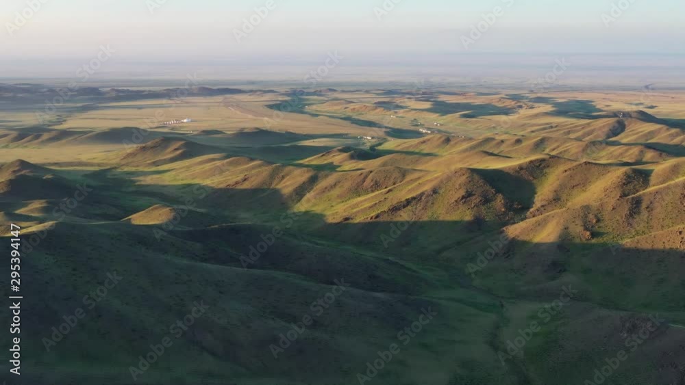 Aerial view of traditional yurts between montains at sunset, Mongolia, 4k Aerial view of traditional yurts between montains at sunset, Mongolia, 4k