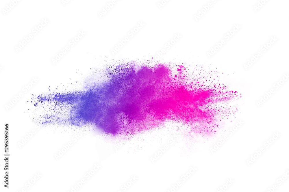 Fototapeta premium Freeze motion of purple color powder exploding on white background.