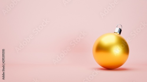 3D illustration. Yellow Christmas ball on light pink background with left copy space