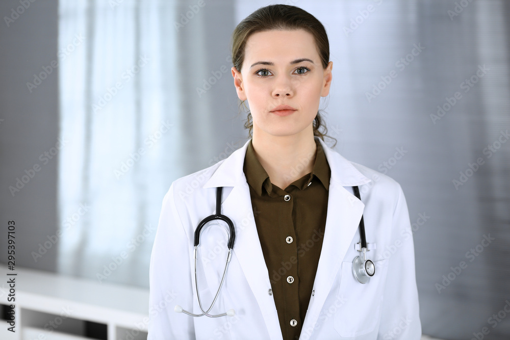 Doctor woman happy and cheerful while standing in hospital office. Perfect medical service in clinic. Medicine and healthcare concept Doctor woman happy and cheerful while standing in hospital office. Perfect medical service in clinic. Medicine and healthcare concept