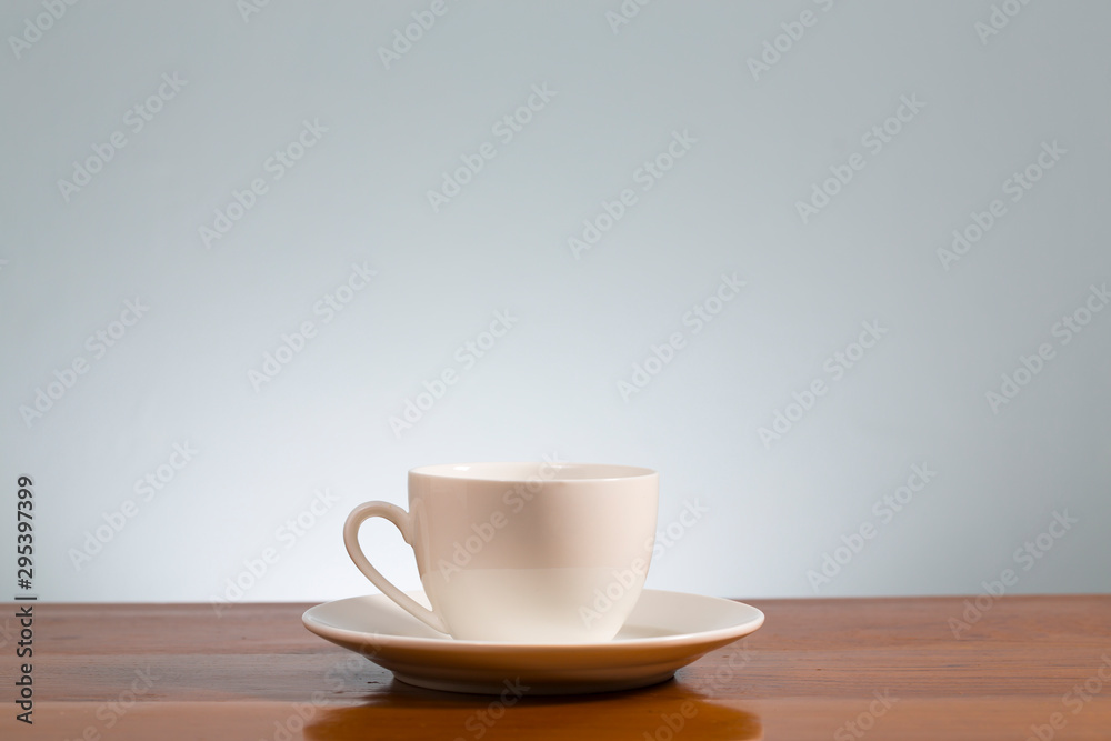 Empty coffee mug on wooden table Empty coffee mug on wooden table