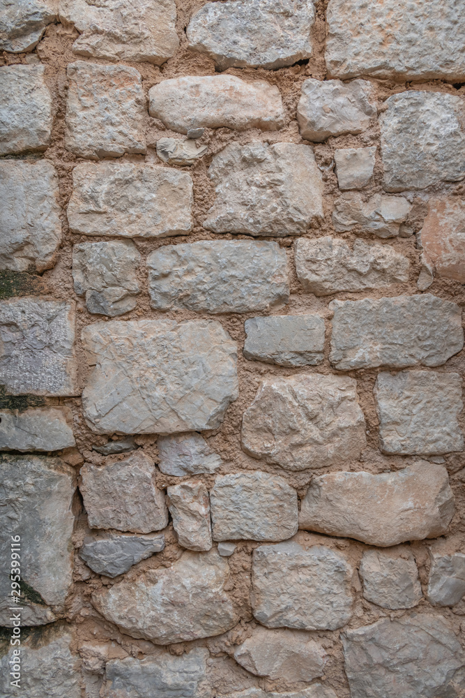 Stone wall texture background - grey stone siding with different sized stones Stone wall texture background - grey stone siding with different sized stones