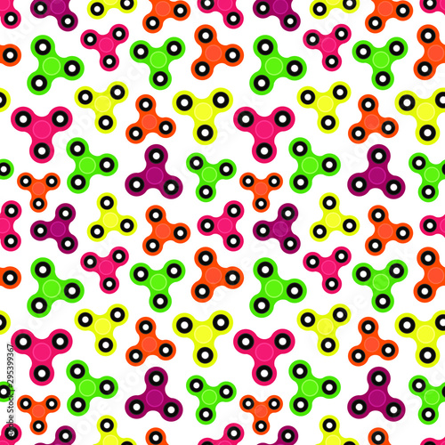 Fidget spinner. Hand toy for stress relief. Seamless pattern with colorful spinners for wrapping paper, wallpaper, web page background and more. Vector illustration. EPS10.
