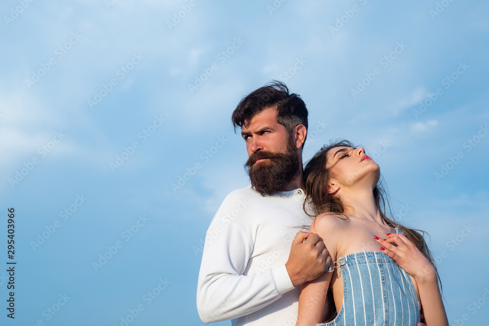 Sexy initiative woman with young aroused man. Beautiful young couple waiting to kiss. Young tender lover enjoys touching soft skin of sensual sexy lady.