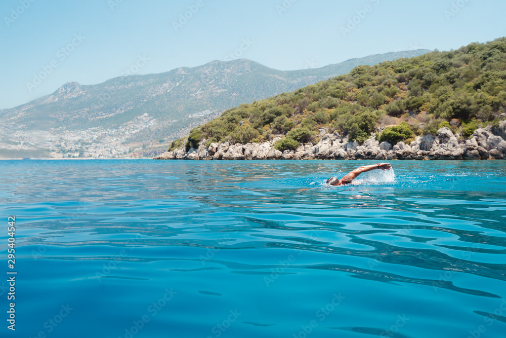 Man swimming in the Mediterranean sea off the coast of Turkey. Man swimming in the Mediterranean sea off the coast of Turkey.