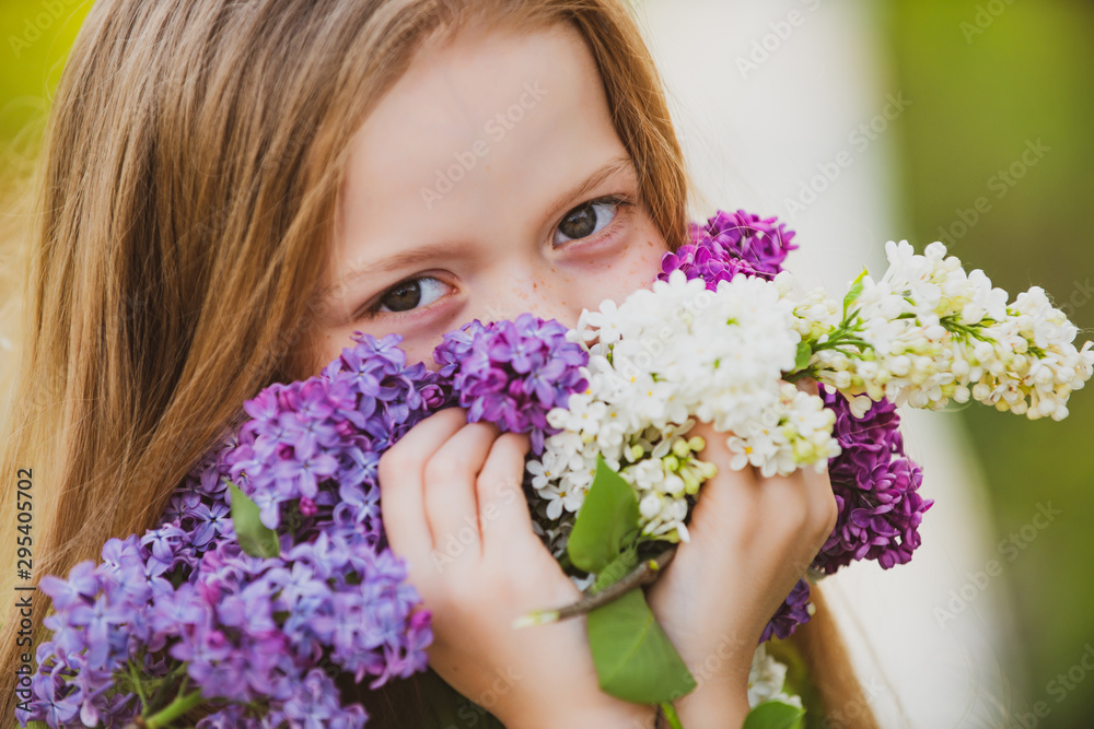 Sweat good-looking european little girl with lilac. Close up kids eyes. Enjoy spring without allergy. Springtime bloom. Pollen allergy. Allergy blooming season. Sweat good-looking european little girl with lilac. Close up kids eyes. Enjoy spring without allergy. Springtime bloom. Pollen allergy. Allergy blooming season.
