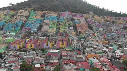 Aerial view of a colorful neighborhood in Ecatepec, Mexico. Drone slowly ascending photo
