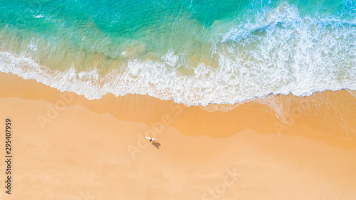 Aerial view of sandy beach and ocean with waves © Southern Creative