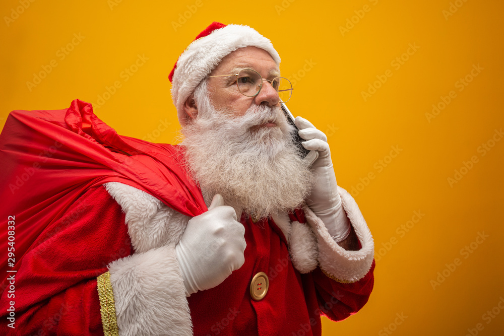 Naklejka premium Holly jolly x mas! Santa in headwear, costume, black belt, white gloves brings gifts for kids, prepared to celebrate, sale promotion, winter december, chatting on telephone. Santa talking on the phone