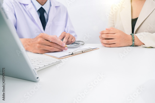 Close up of doctor and patient sitting healthy