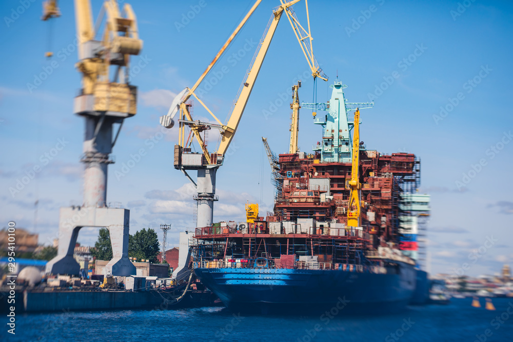 Fototapeta premium Process of building and construction a massive russian nuclear-powered icebreaker vessel ship in the shipyard dock