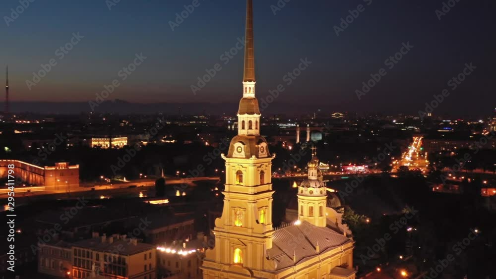 Aerial around view of Peter and Paul Fortress with cityscape after sunset, Saint-Petersburg, Russia, 4k