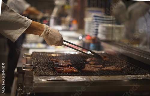 The chef grilled the meat on the grill.