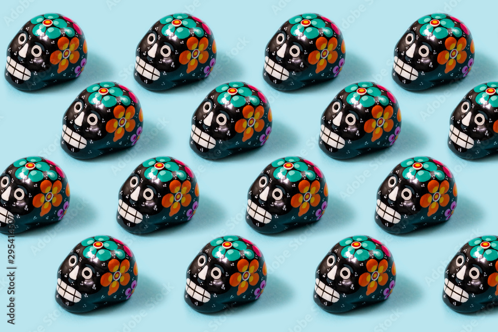 Texture of skulls and colorful handmade skulls of the day of the dead tradition in Mexico