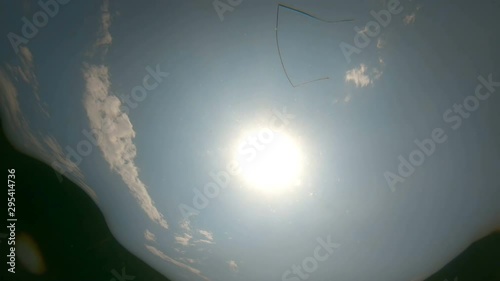 Underwater view of the sea surface and the sunbeams reflectiong on it photo